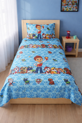Children's bedroom with a bed featuring Paw Patrol bedding set.
