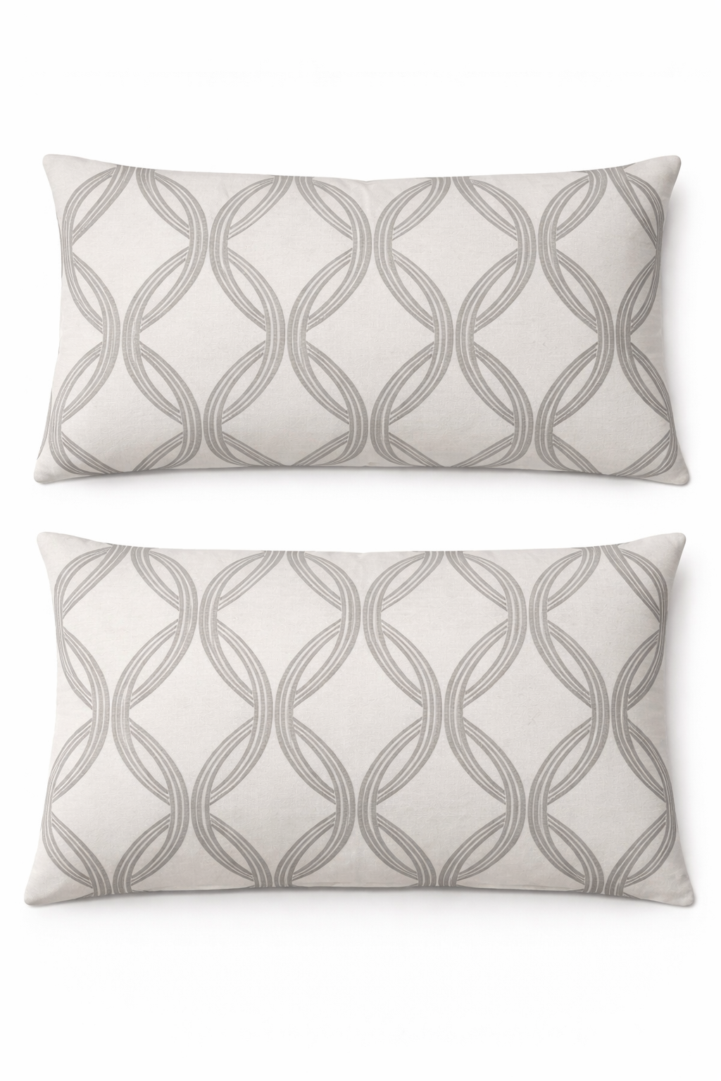 Two gray patterned pillows on a white background