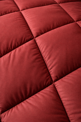 Close-up of a red quilted fabric surface