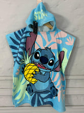 Children's hooded towel with cartoon character holding a pineapple on a light gray background