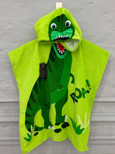Green dinosaur-themed hooded towel on a gray background