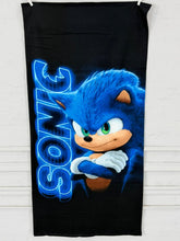 Black towel with Sonic the Hedgehog graphic on a white background