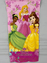 Disney Princess-themed towel with characters on a pink background