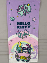 Hello Kitty beach towel with colorful graphics and text on a purple background
