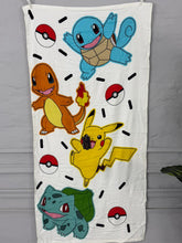 Towel with cartoon characters and Poké Ball graphics on a white background