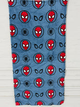 Spider-Man patterned towel on a wooden surface