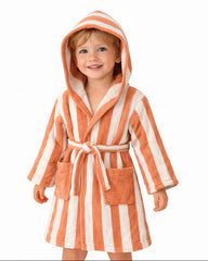 Child wearing an orange and white striped hooded robe with animal ears on a white background