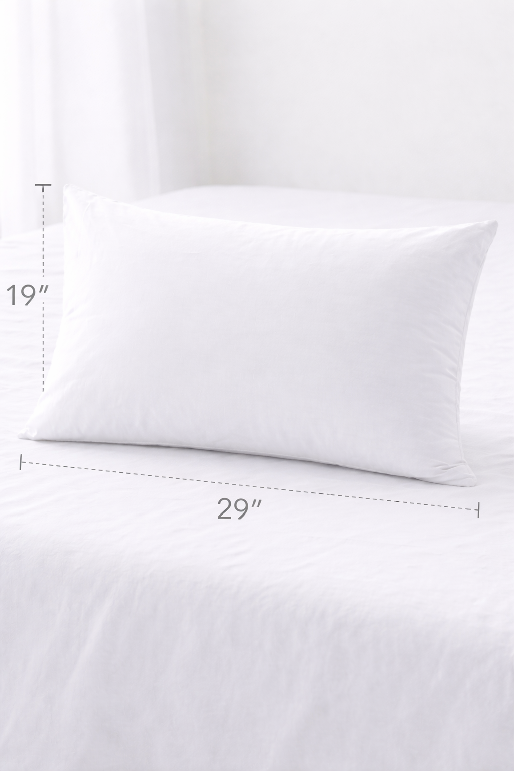 White pillow on a white background with measurements indicated
