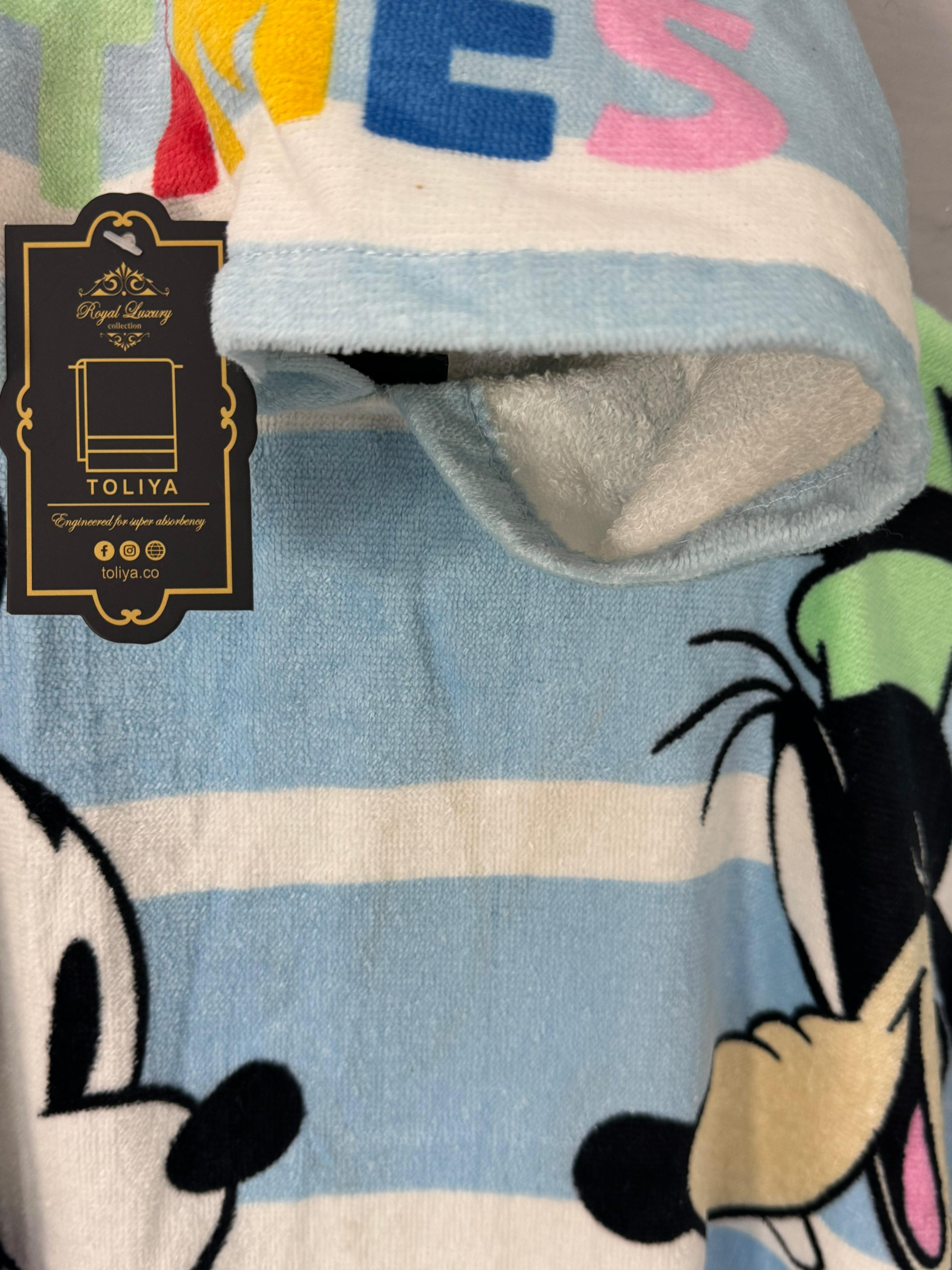 Children's blanket with cartoon characters and colorful letters, featuring the brand 'Toliya'.