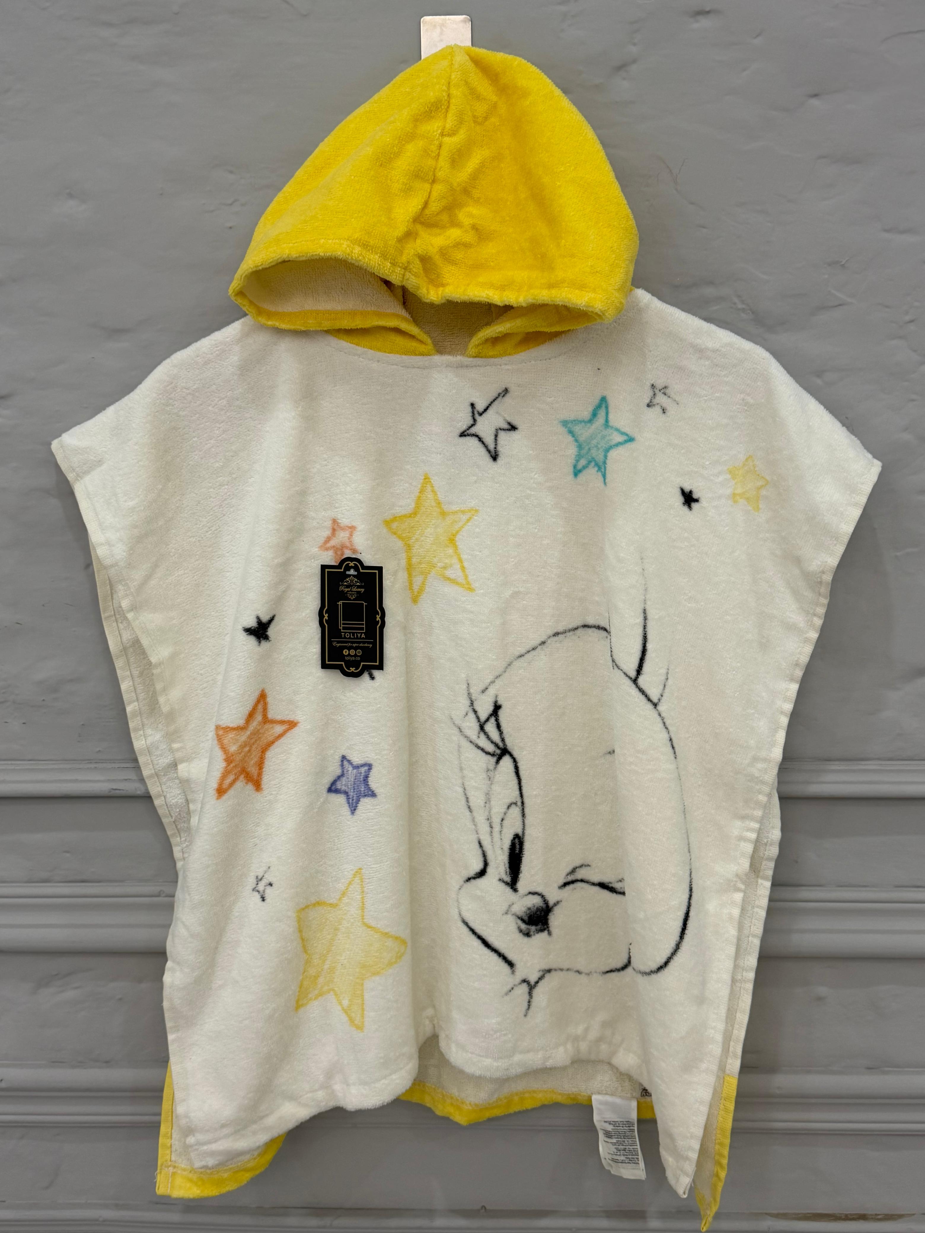 Children's hooded towel with cartoon character and stars on a gray background