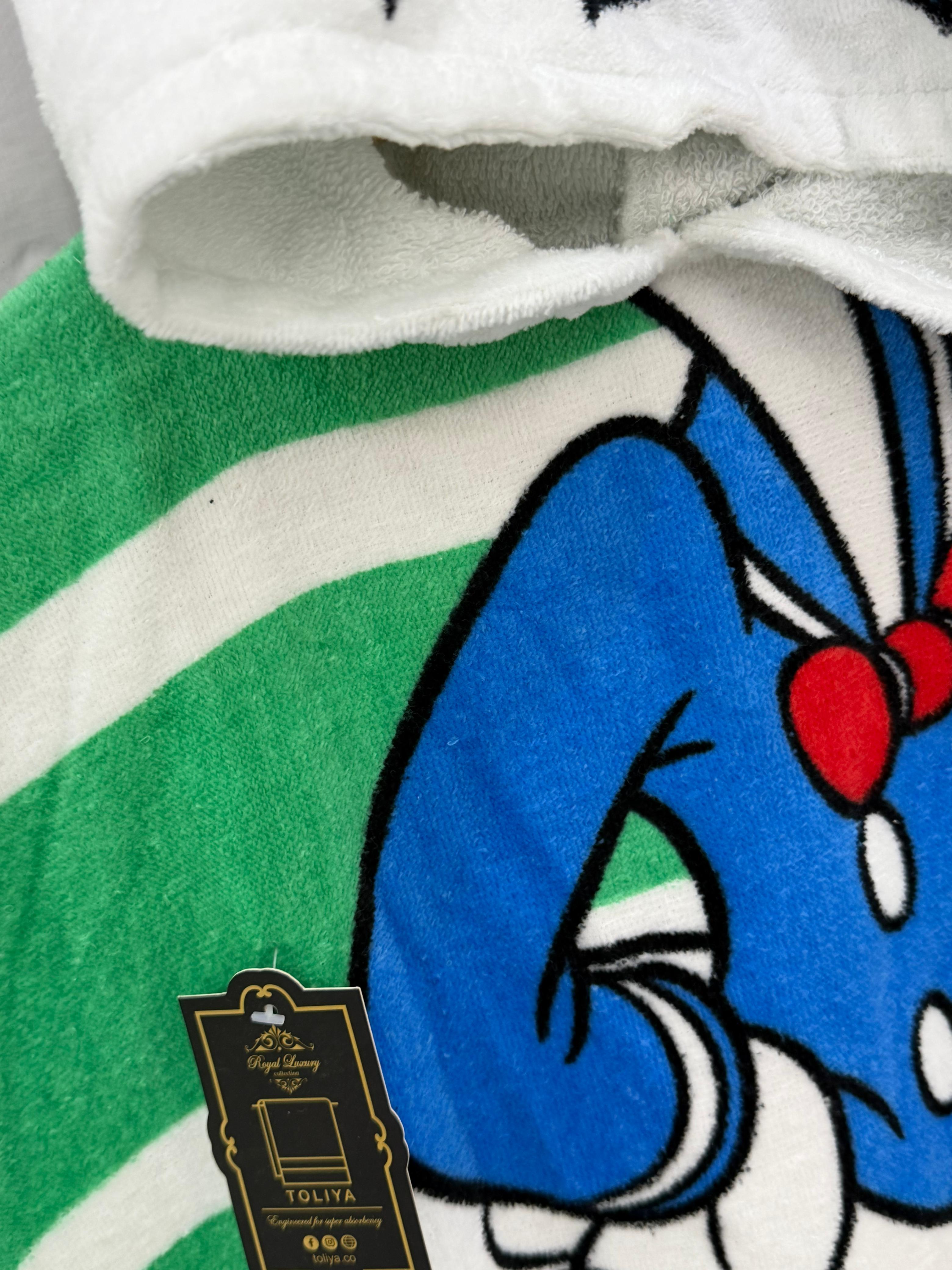 Close-up of a cartoon character on a blanket with a brand tag visible.
