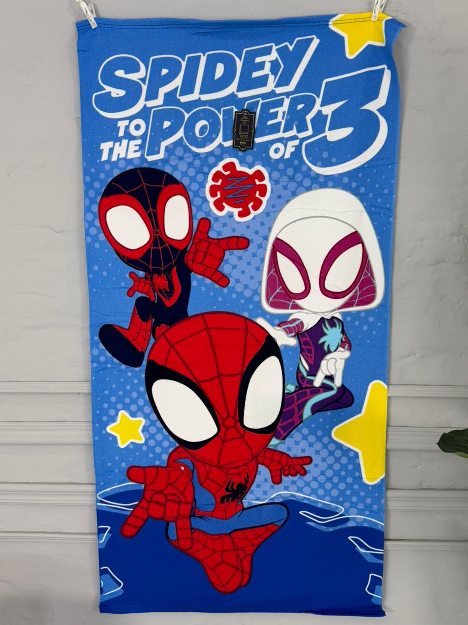 Spider-Man-themed towel with characters and text on a blue background