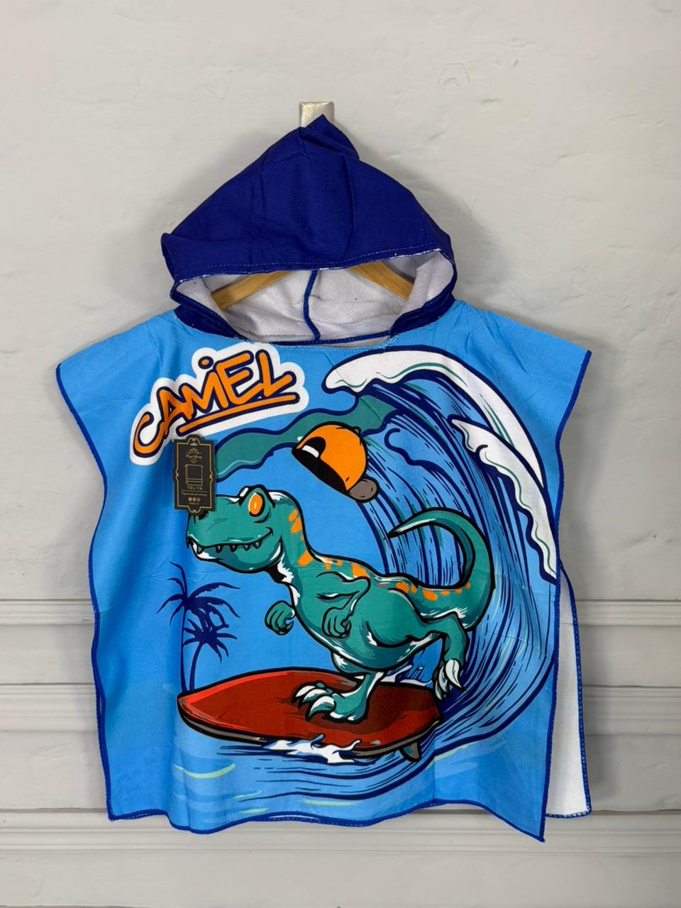 Blue hooded towel with a dinosaur surfing design and 'Camel' branding on a white background.