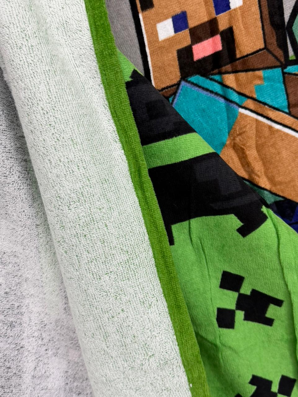 Close-up of a Minecraft-themed product with a character design on a green background.