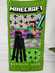 Minecraft-themed towel with pixelated characters and 'Survival Mode' text on a green background.