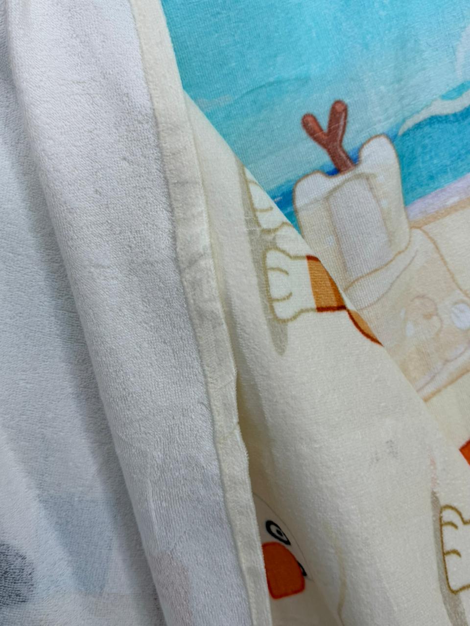 Close-up of a cartoon character on a fabric surface