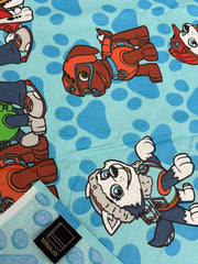 Cartoon character fabric with a blue polka dot background