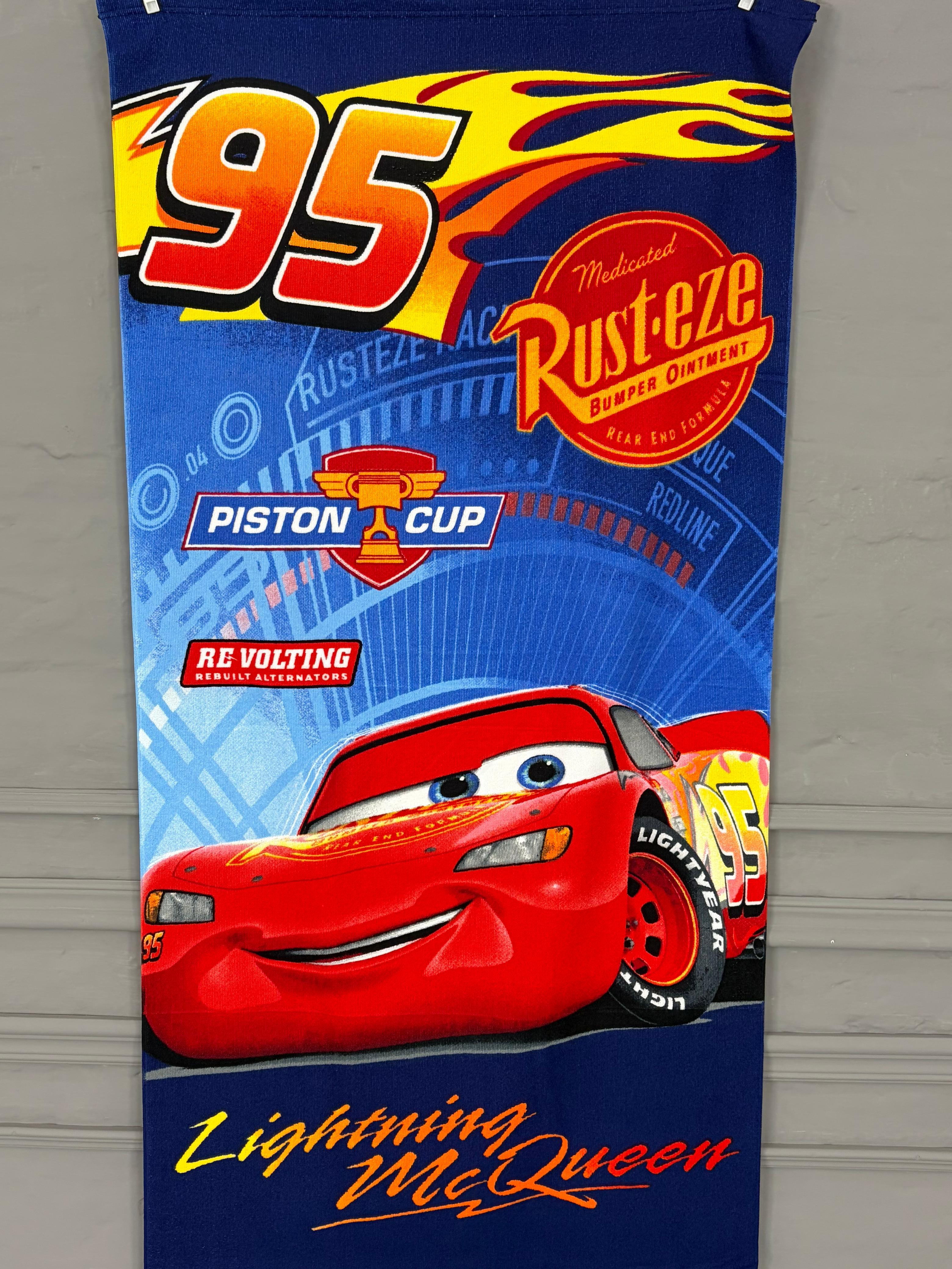 Towel with Lightning McQueen and Rust-Eze branding on a blue background