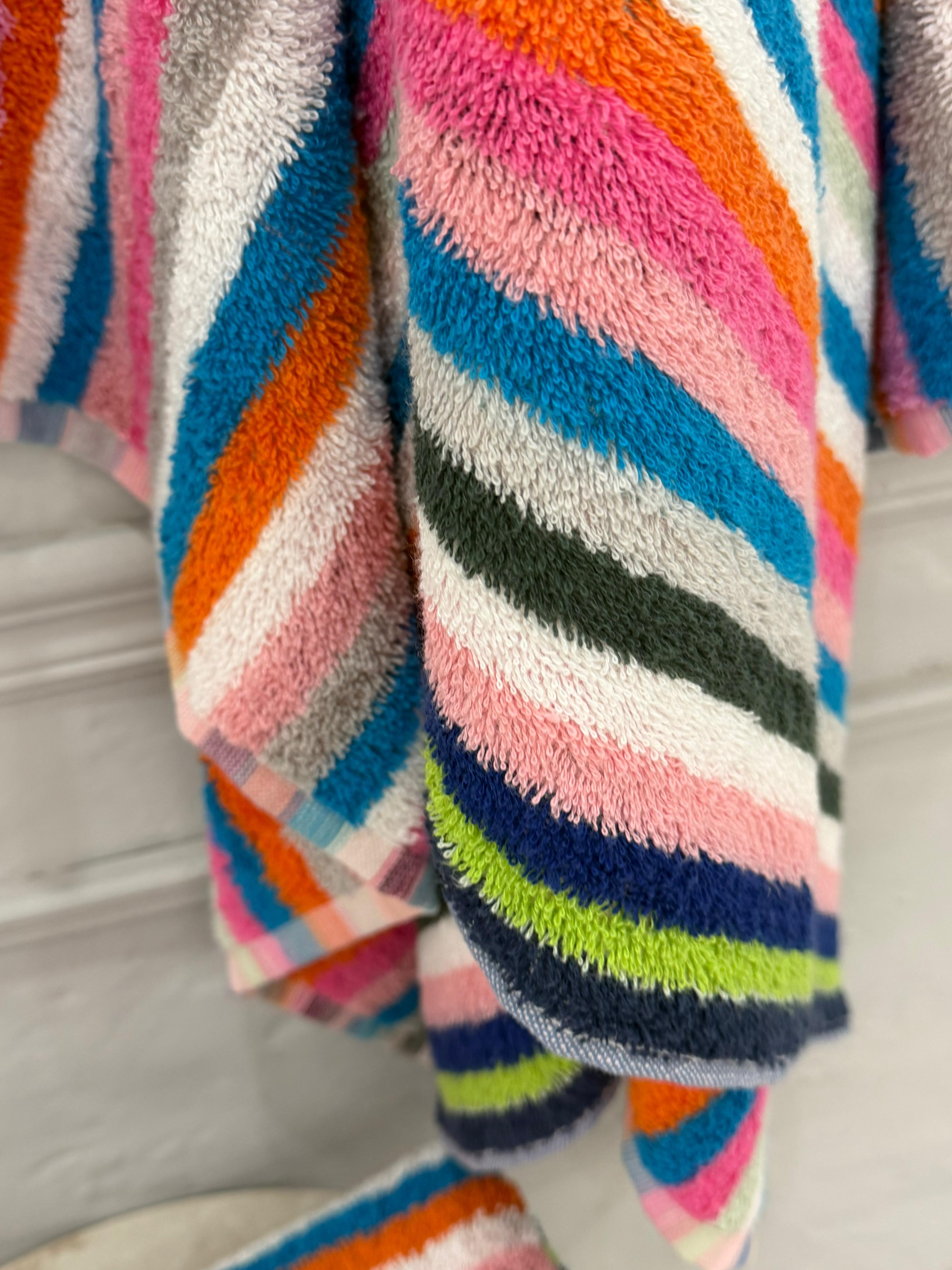 Multicolored striped fabric with a soft texture on a neutral background