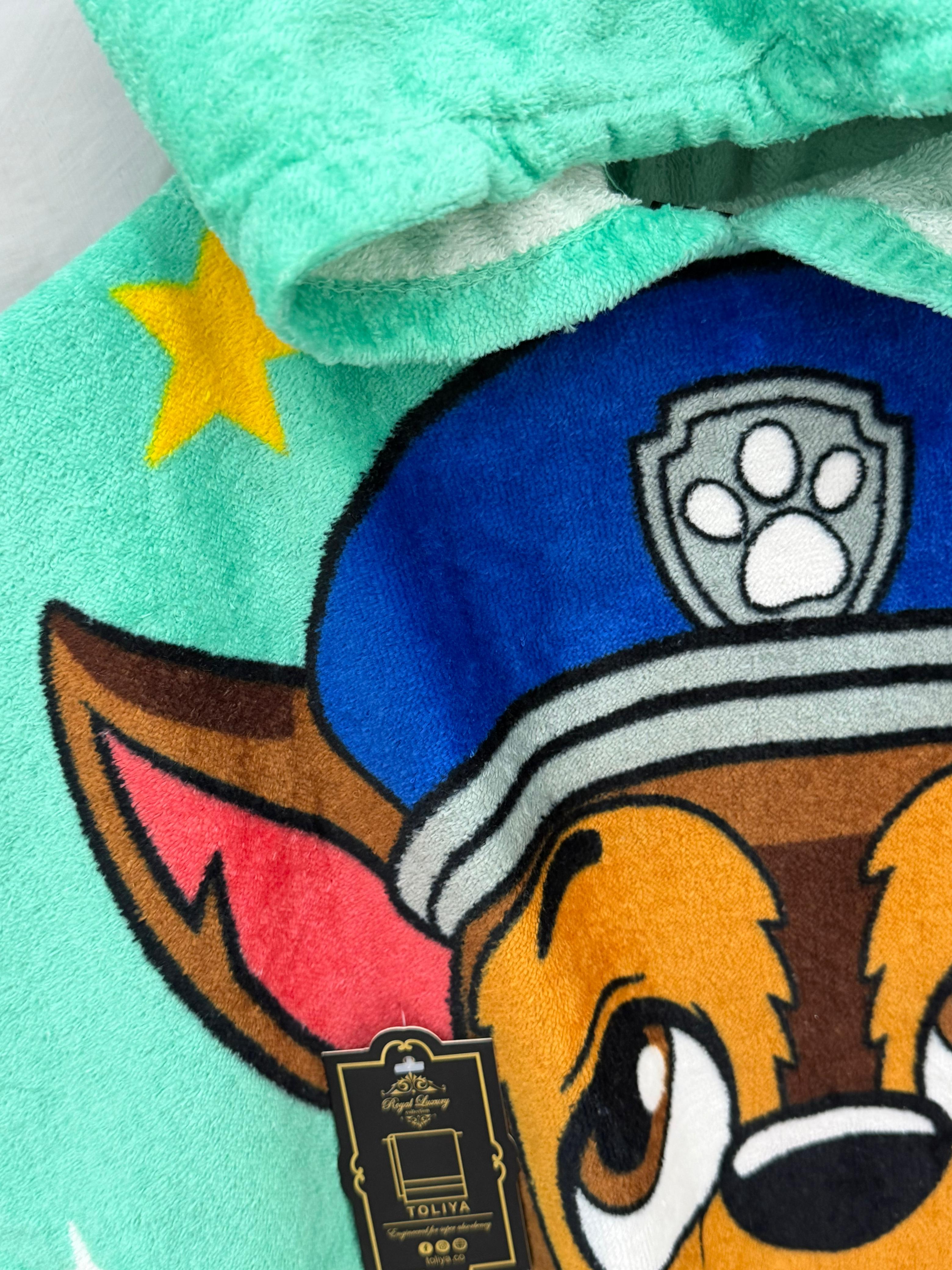 Close-up of a plush toy with a cartoon character wearing a police hat and star, on a light green background.