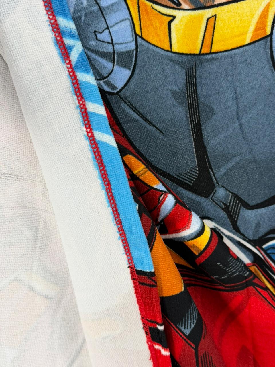 Close-up of a character from a superhero costume with colorful design elements.