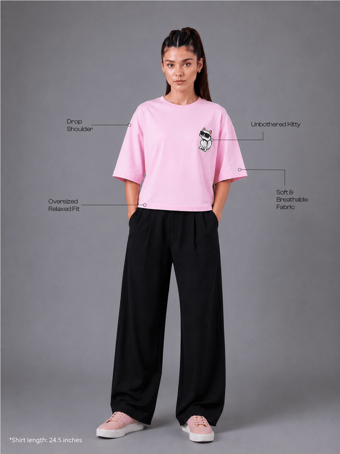 Person wearing a pink t-shirt and black pants on a gray background